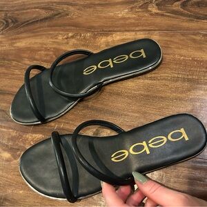 Bebe Black Strappy Sandals with Gold hardware